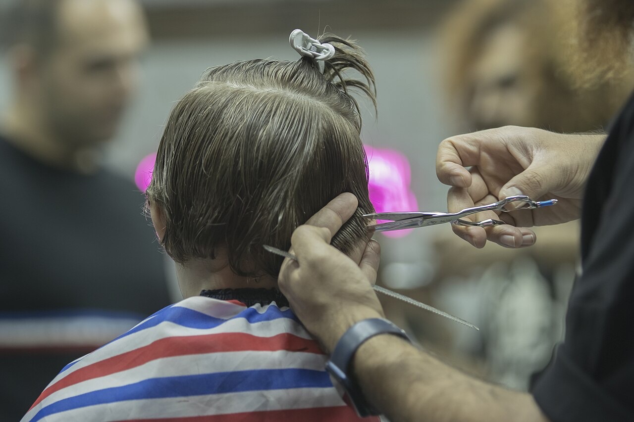 Scissors cut at the back of a client's head